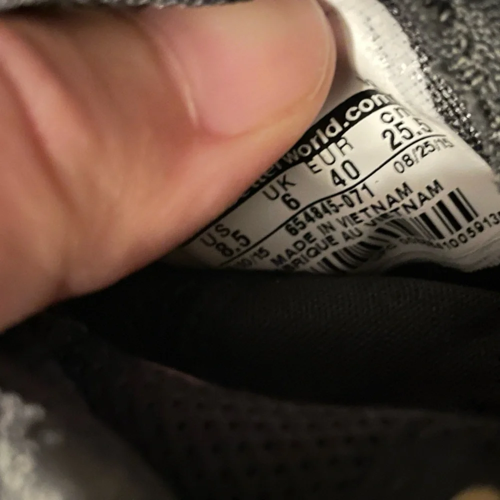 Nike Women’s 8.5 Black and Gold Sneakers